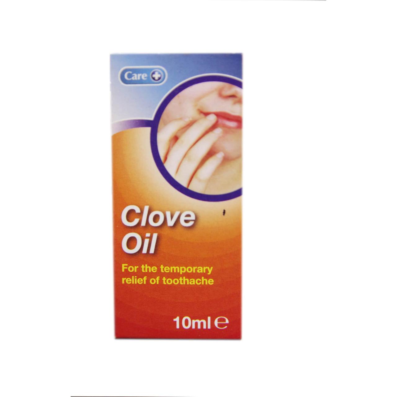 Clove essential oil isolated on white background. Clove oil glass ...